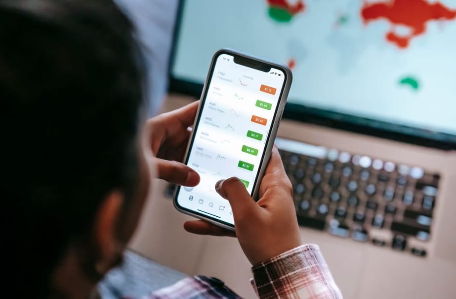 Self-employed person reviewing income and expense records in a mobile app